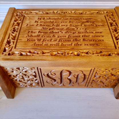 Close up view of the carved monogram and poem and carvings on handcrafted wood cremation urn box